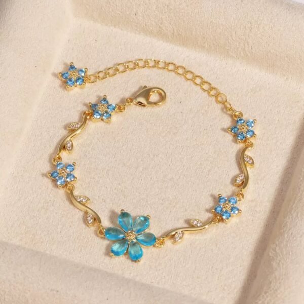22 karet Gold Plated Diamond Cut Stainless Steel Flower Sky blue trendy bracelet.